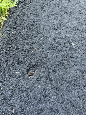 Close-up of fresh asphalt driveway